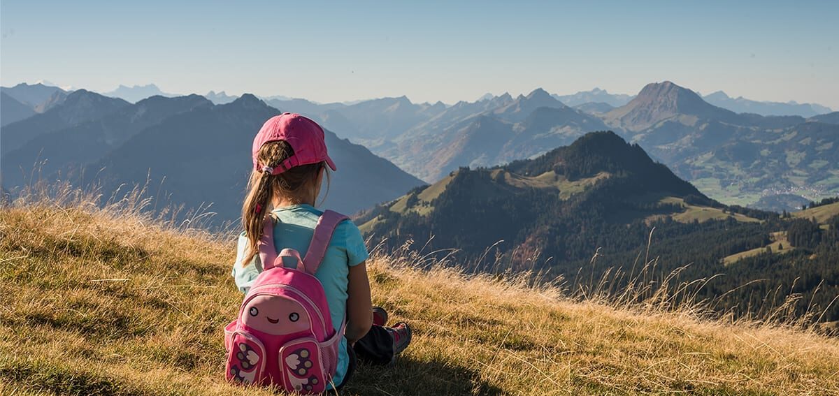 Girl sitting alone on a mountain